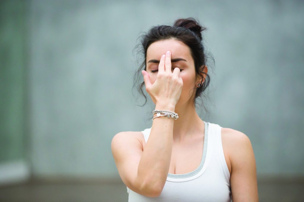 Woman doing Yoga breathing.