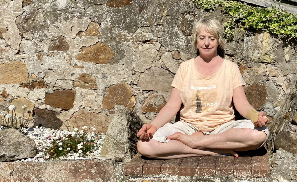 Yoga teacher sitting in meditation photo for new yoga class in West Kilbride.